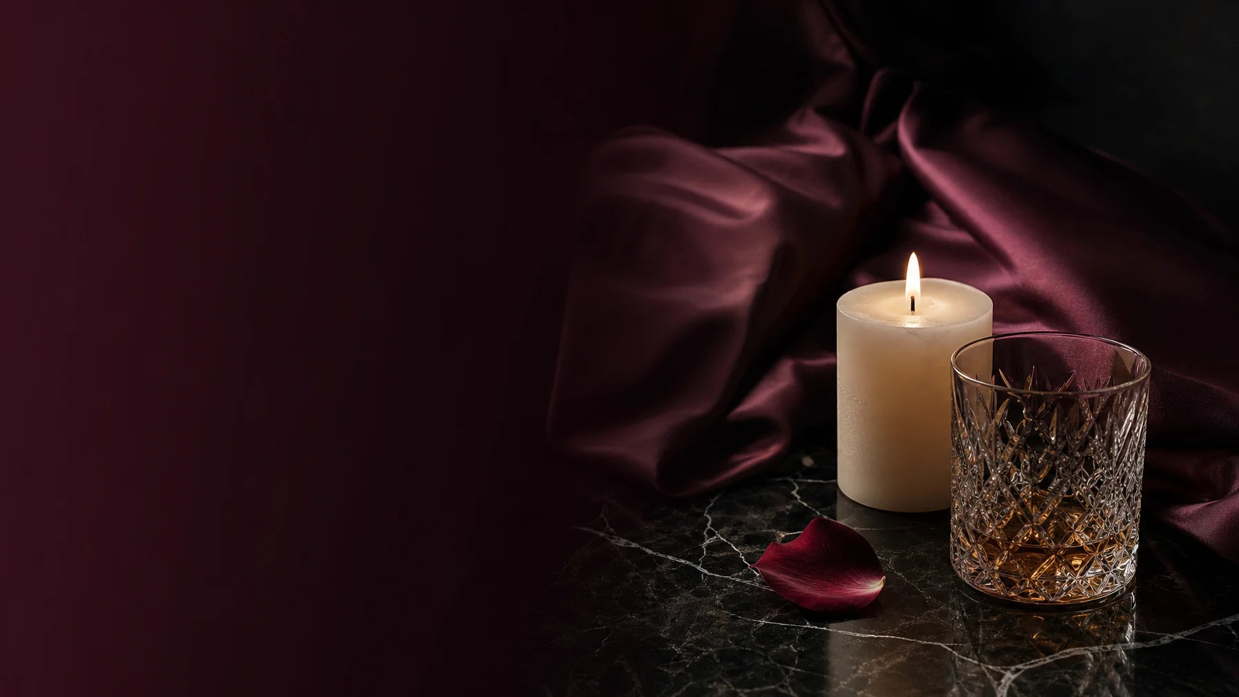 Wide 16:9 hero banner, editorial luxury photography. On the right side of the frame, a dimly lit, el
